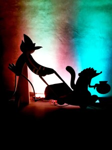 Mordecai and Rigby silloutted by moonlight on the rooftop of the Downtown Independent. 